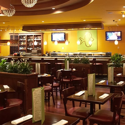 The bar and seating area inside Angel's Grill House