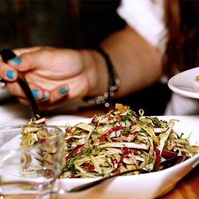 A person enjoying a fresh salad